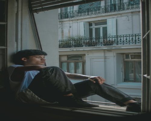 Relaxed man resting and meditating in a peaceful natural environment